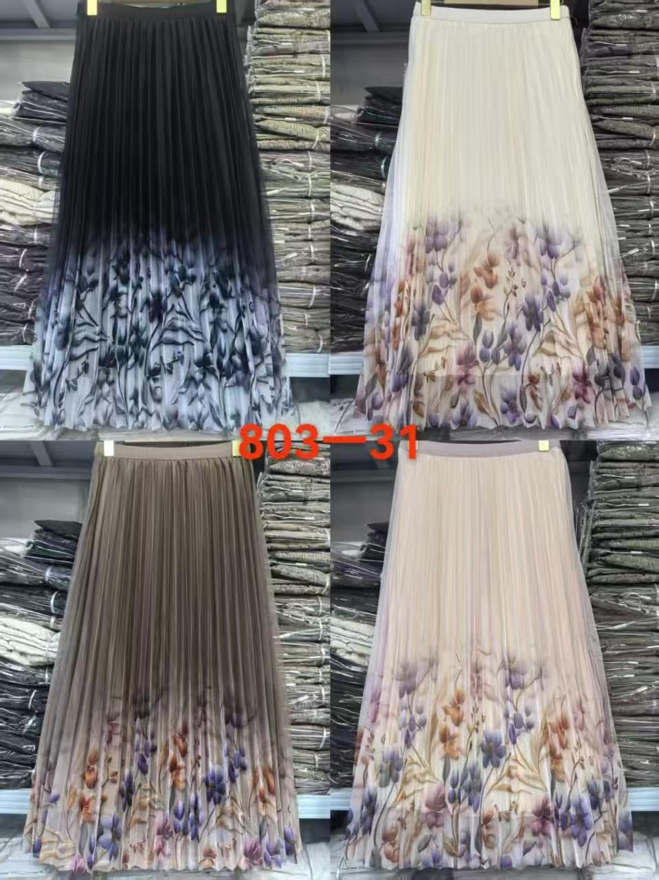 Four pleated midi skirts displayed side by side in a grid, showing different color and pattern options: black and white ombre, cream and purple floral, taupe and orange floral, and cream and purple floral. A red text overlay reads '803-31'.