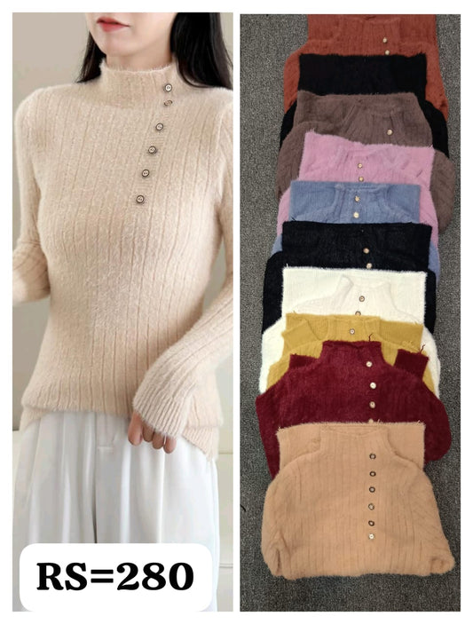 Beige ribbed sweater worn by a person on the left, with a stack of various colored sweaters on the right.