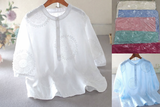 White lace top on a hanger with additional colors shown in plastic bags.